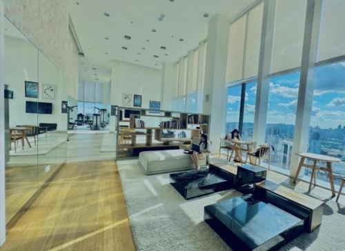 a living room with a view of a building at The platinum KLCC By Garden Suites in Kuala Lumpur