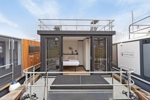 a room on the upper deck of a house at Luxurious waterloft near beach and centre in Zeewolde