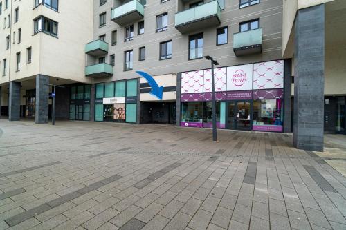 an empty street in front of a building at BNB New Beautiful Apartment in the Center of Ostrava with option Garage Parking in Moravská Ostrava