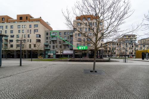 a tree in the middle of a city street at BNB New Beautiful Apartment in the Center of Ostrava with option Garage Parking in Moravská Ostrava