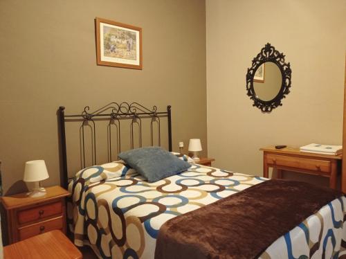 Una cama o camas en una habitación de Hospedaje Don Pelayo