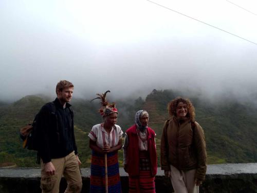 a group of people standing on top of a mountain at Las vegas lodge and restaurant in Banaue