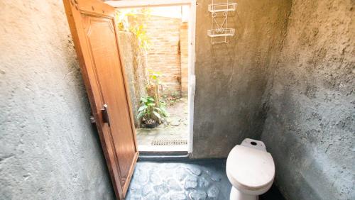 Ванная комната в Rumah Gaharu - Kamar Ngarep 001