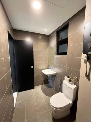 a bathroom with a toilet and a sink at MFA Putrajaya Homestay in Putrajaya