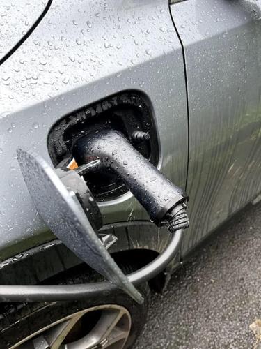a hose is attached to the side of a car at The Burrow Devon in Longdown