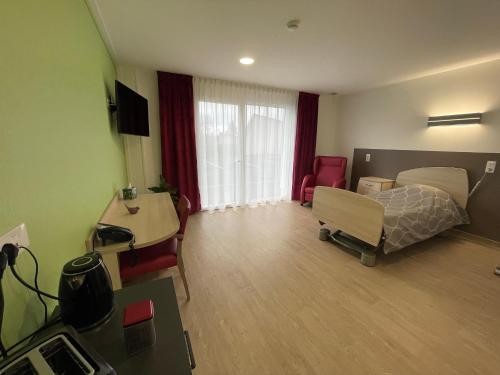 Et tv og/eller underholdning på Relais Les Rives du Lac