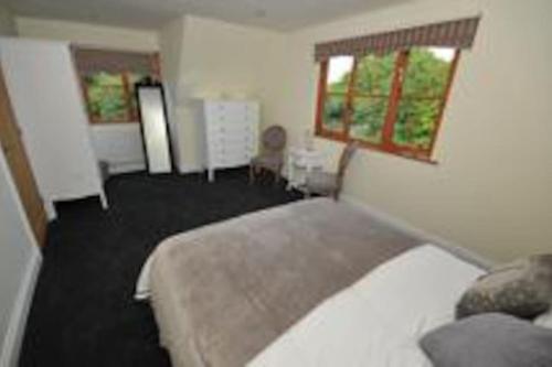 a bedroom with a bed and a window in a room at Home from home in Lee-on-the-Solent