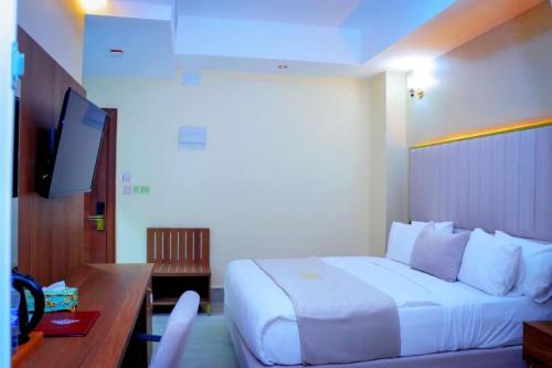 Postel nebo postele na pokoji v ubytování Jees Hotel