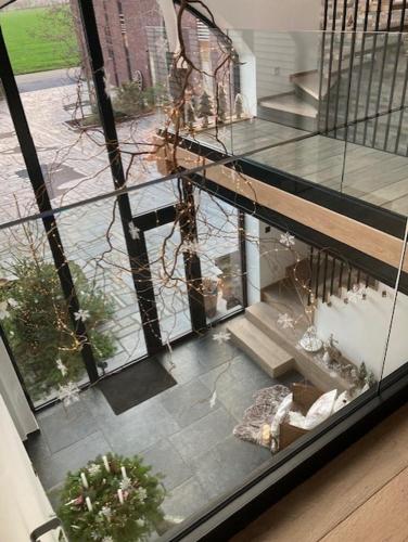 an aerial view of a house with stairs and plants at Les Arbres sous le vent à 10 min de Pairi Daiza in Jurbise