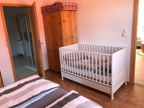 Postel nebo postele na pokoji v ubytování Ferienwohnung Dreimaster W2