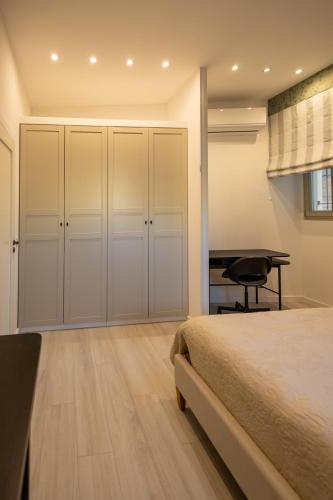 a bedroom with a bed and a desk at Marina View 34 in Birgu