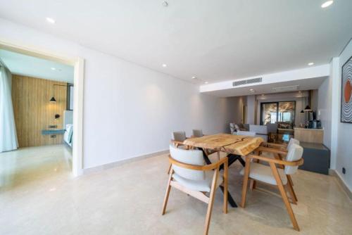 a dining room with a wooden table and chairs at Lures Hotel in Kalkan