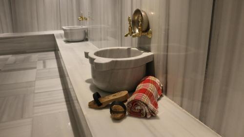 a bathroom with a toilet and a sink and a shower at Lures Hotel in Kalkan