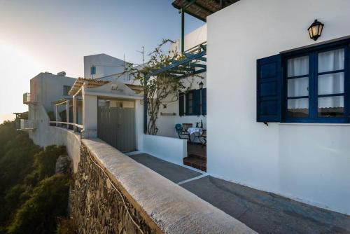 a view of a house from a wall at Melisses Sea View Studio in Plaka Milou