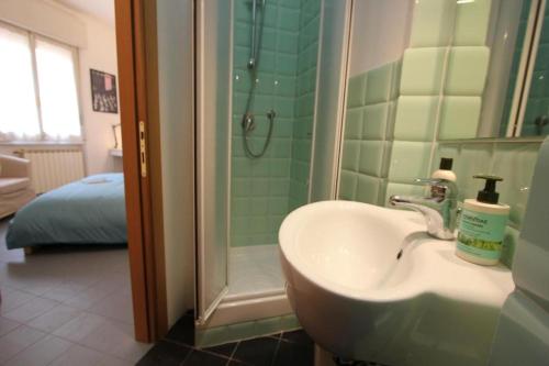 a bathroom with a sink and a shower at Barbadori Suite in Florence