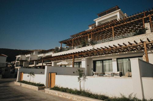 a white building with a lot of windows at Lures Hotel in Kalkan