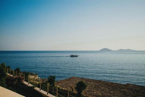 a boat in the middle of a large body of water at Lures Hotel in Kalkan