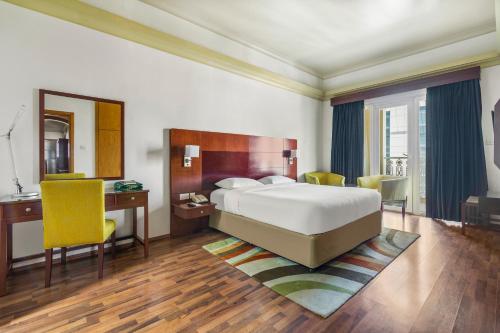 Ένα ή περισσότερα κρεβάτια σε δωμάτιο στο Al Khoory Hotel Apartments Al Barsha
