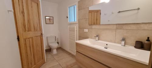 a bathroom with a sink and a toilet at mas des oliviers in Gordes