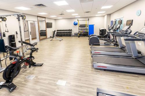 a gym with treadmills and elliptical machines at Hampton Inn Selma, Ca in Selma