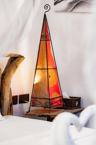 a model of a sail boat on a table at Emerald Palm Courtyard Hotel in Zanzibar City
