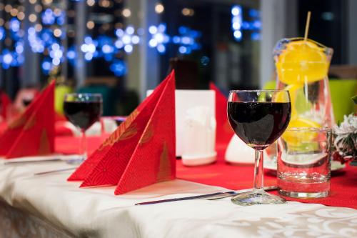 a table with red napkins and wine glasses on it at MariSol in Świnoujście