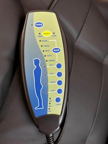 a close up of a car seat control panel at Cosy and stylish studio in Bucharest