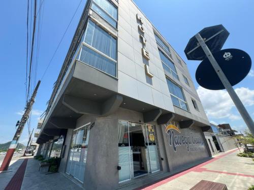 a building with a sign on the side of it at Navega Beach Palace Hotel in Navegantes