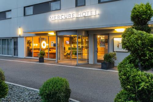 a store front of a hotel with a sign on it at Mercure Belfort Centre in Belfort