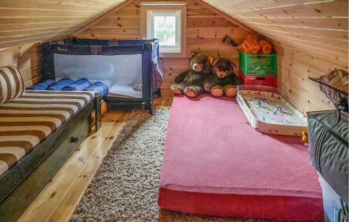 a room with two beds and stuffed animals in a cabin at Nice Home In seral With Wifi in Åseral