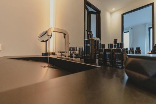 a bathroom with two sinks and two mirrors at A-ROSA Hotel Ceres am Meer - Adults Only in Binz
