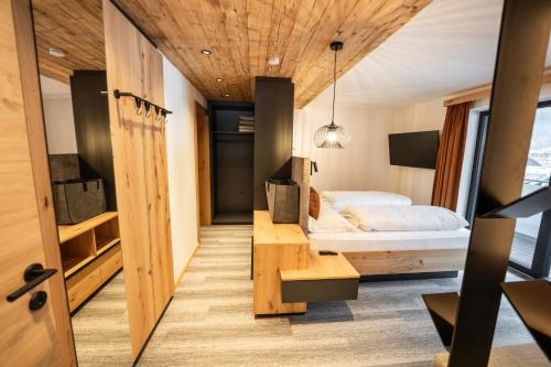 a bedroom with a bed and a desk in a room at Apartment Gosauschmied in Gosau