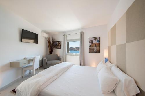 Postel nebo postele na pokoji v ubytování Greco Philia Hotel Boutique