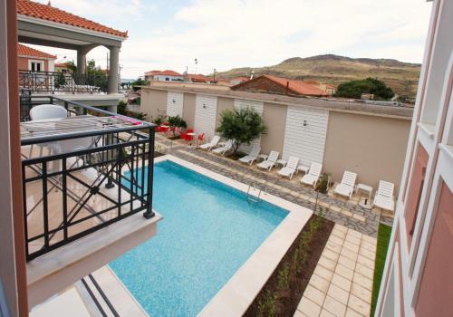 a view of the pool from the balcony of a house at SunSea Hotel Petra in Petra