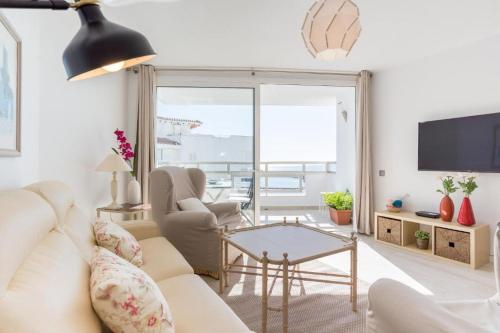 a living room with a couch and a table at SEA VIEW & BEACH ACCESS - Center - Parking in Marbella