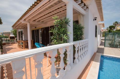 a balcony of a house with a swimming pool at Casa Novo Horizonte by Portucasa in Altura