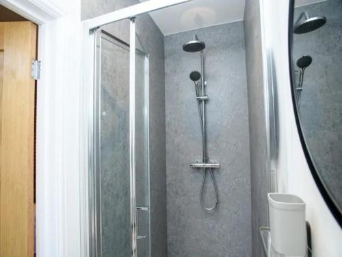 a shower in a bathroom with a glass shower backdoor at Pass the Keys Garden Room in City Centre in Lincoln