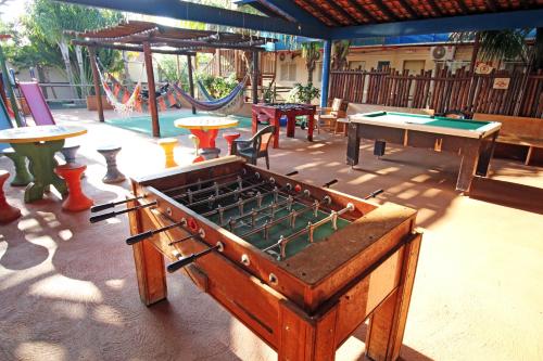 a group of ping pong tables and ping pong tablesktop at JS Thermas Hotel in Olímpia