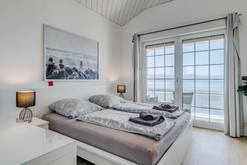 Katil atau katil-katil dalam bilik di Apartments with pool Vrdoljak