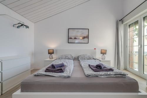 Katil atau katil-katil dalam bilik di Apartments with pool Vrdoljak