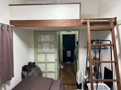 a room with a loft bed and a desk at Vintage III - Vacation STAY 14774 in Fukuoka