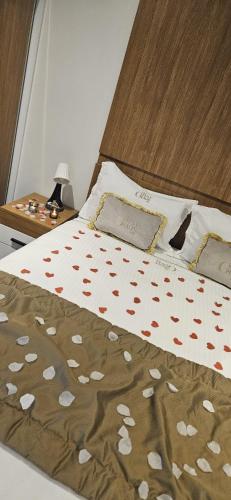 a bedroom with a bed with hearts on it at Guesthaus 1 in Dudelange