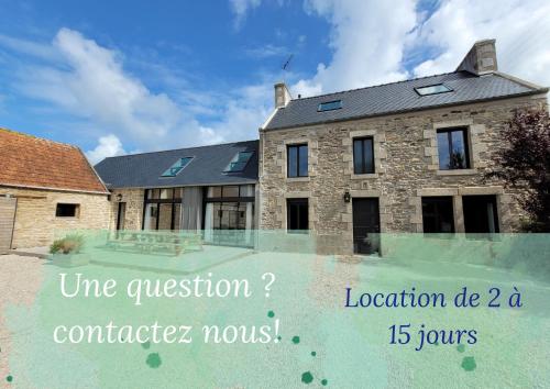 a house with a sign in front of it at Maison familiale proche plages avec jacuzzi in Tréflez