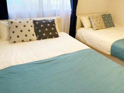 Ein Bett oder Betten in einem Zimmer der Unterkunft Star House Miyakojima - Vacation STAY 83169