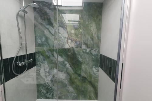 a shower with a glass door in a bathroom at Clairville : Georgian Suite - Central Ross-on-Wye in Ross on Wye