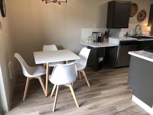 a kitchen with a table and chairs in a kitchen at Modern Lofts At Aria 8 in Kalispell