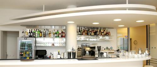 a bar with a lot of bottles of alcohol at Hotel Erwin Junker in Holice