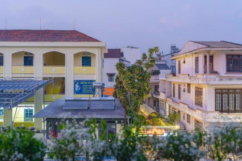 a group of buildings in a city at Mie House Da Lat in Xuan An