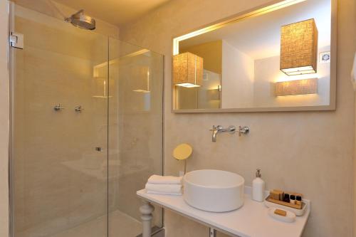 a bathroom with a sink and a shower at Villa Sassolini Suite & Rooms - Country Boutique Hotel in Montevarchi