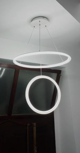 a large white light hanging from a ceiling at La casetta di Tano in Morano Calabro
